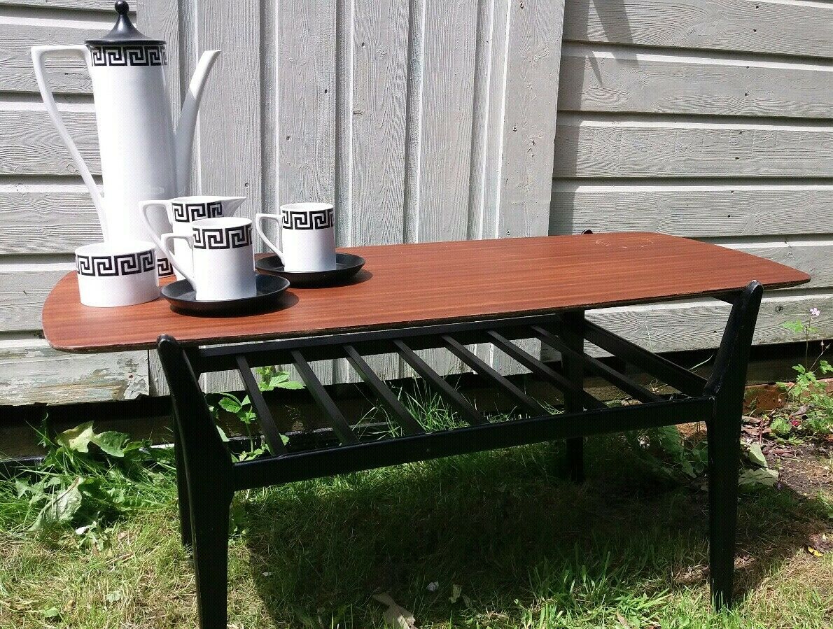 MCM Nathan ebonised leg Tola coffee table with magazine rack