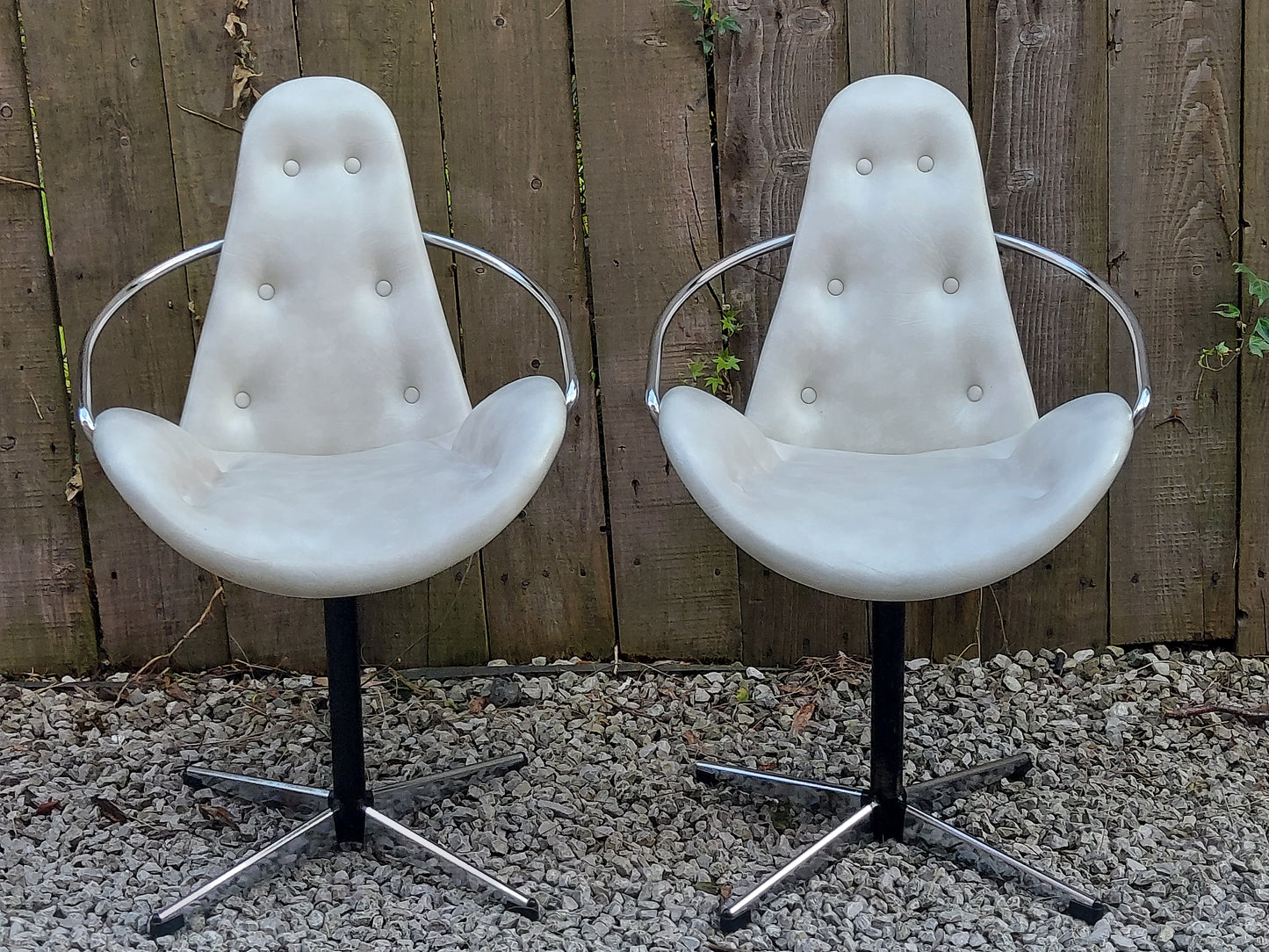 mid century modern pair atomic style cream vinyl swivel chairs