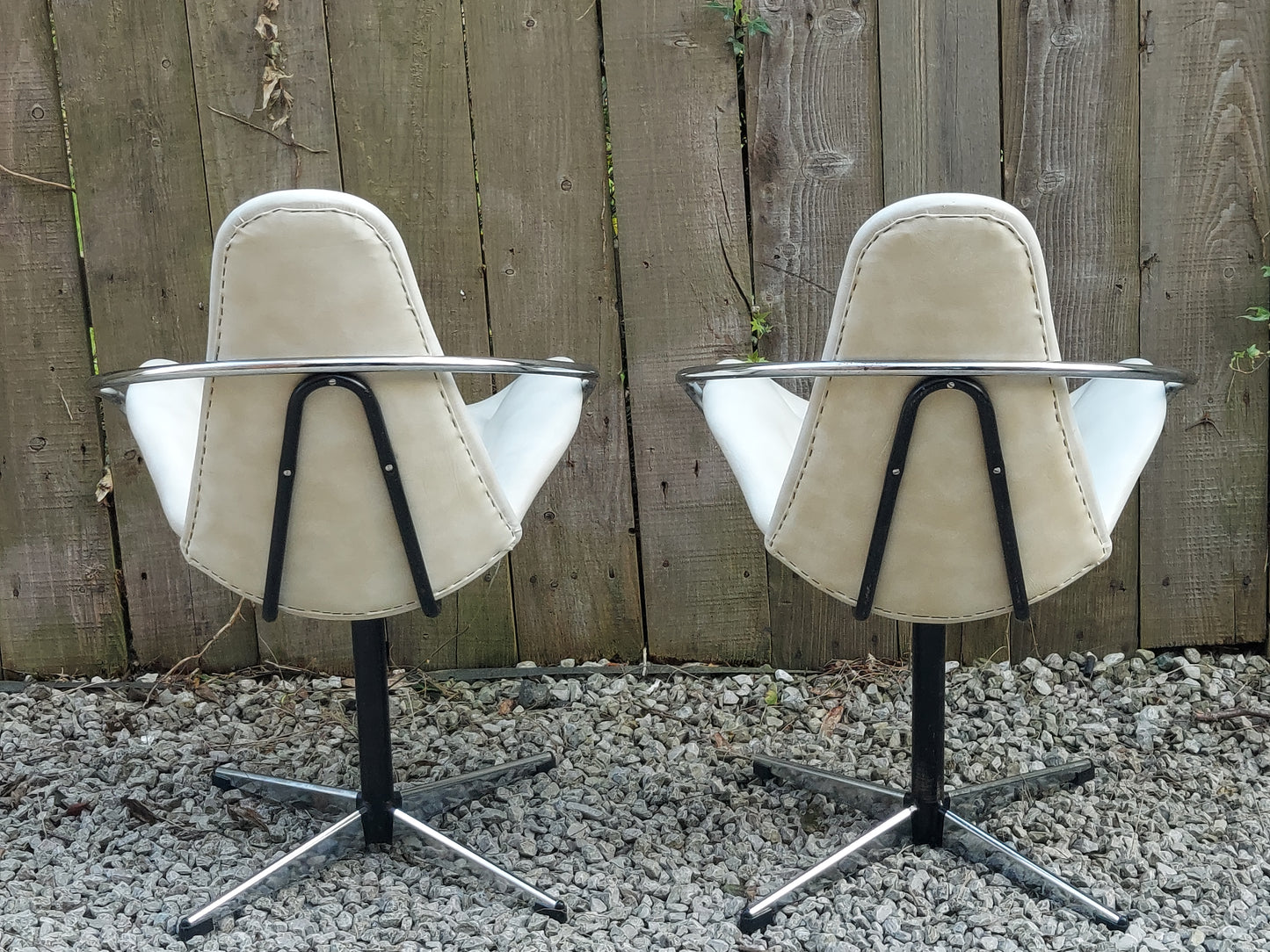 mid century modern pair atomic style cream vinyl swivel chairs