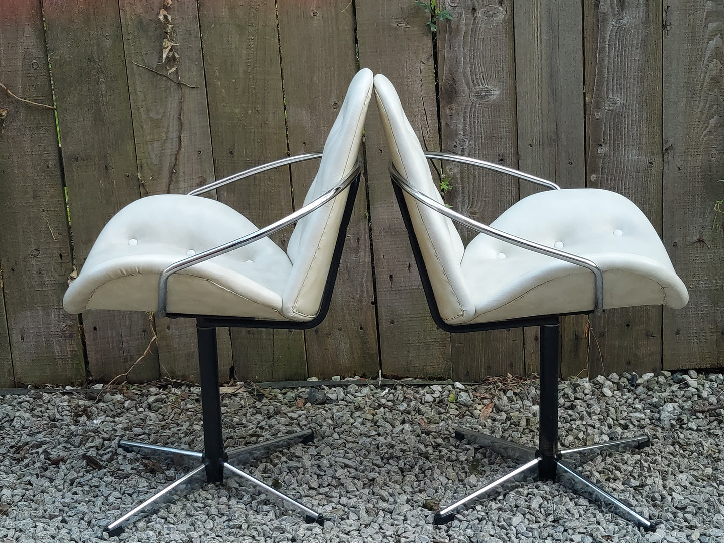 mid century modern pair atomic style cream vinyl swivel chairs