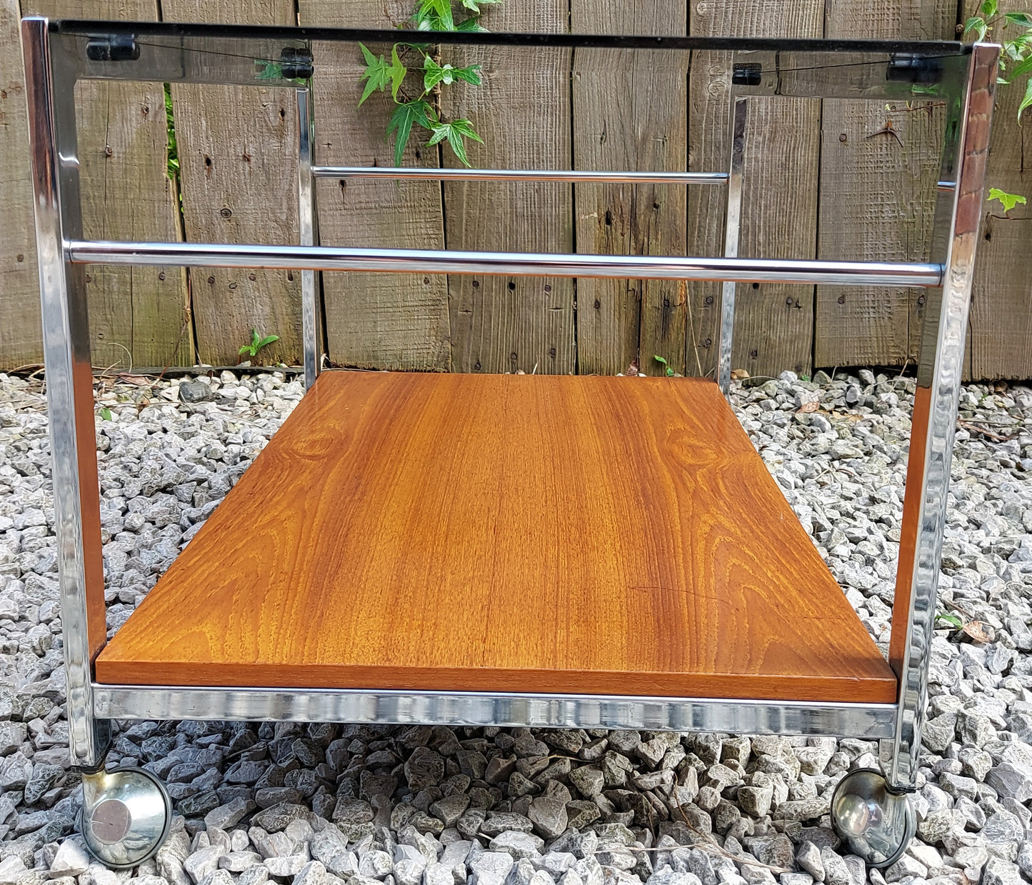 mcm Howard Miller smoke glass metal teak coffee table on wheels