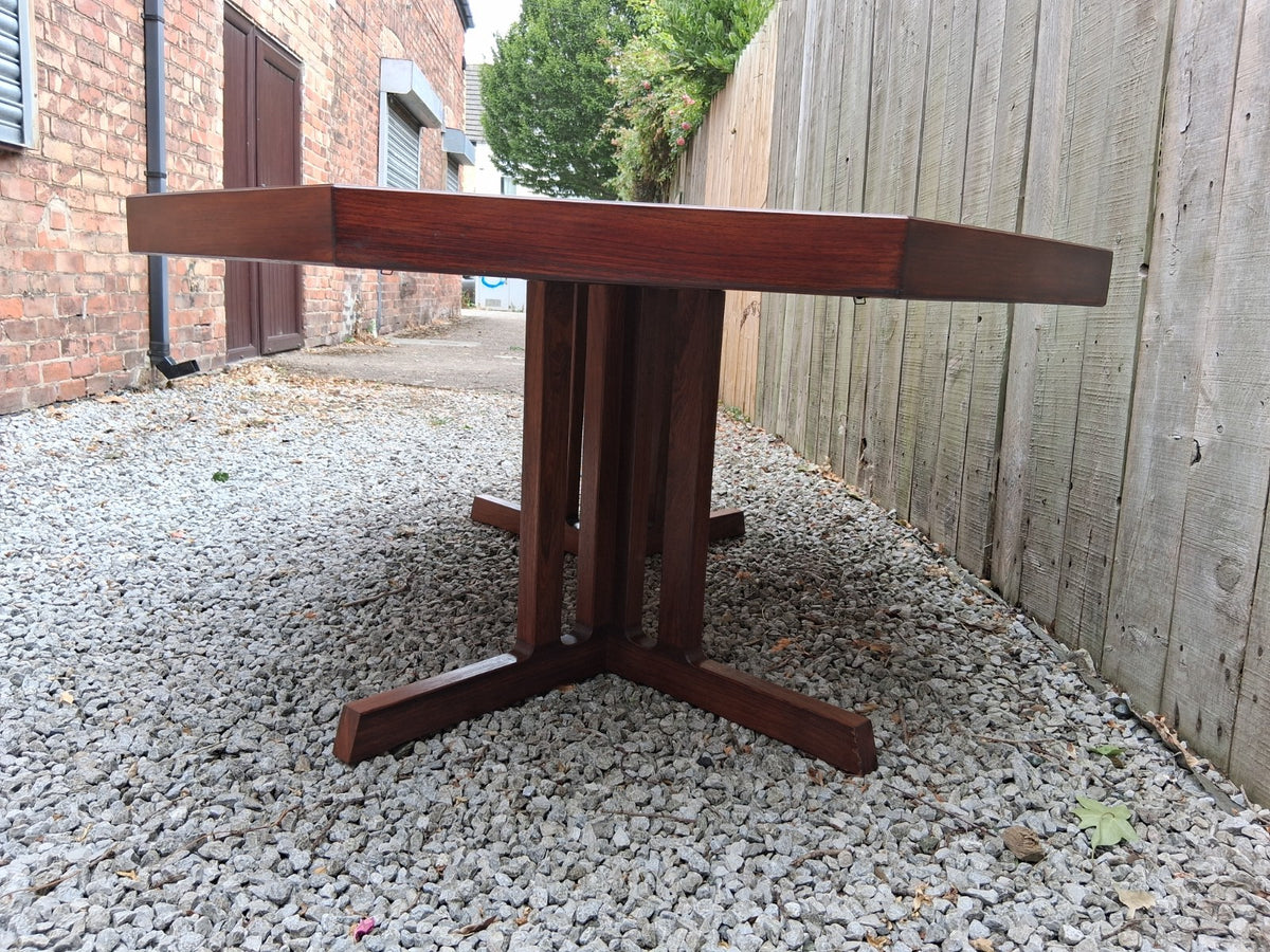 MCM Johannes Andersen octagonal rosewood dining table produced by Hans Bech