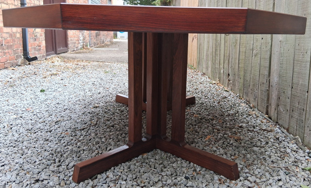 MCM Johannes Andersen octagonal rosewood dining table produced by Hans Bech